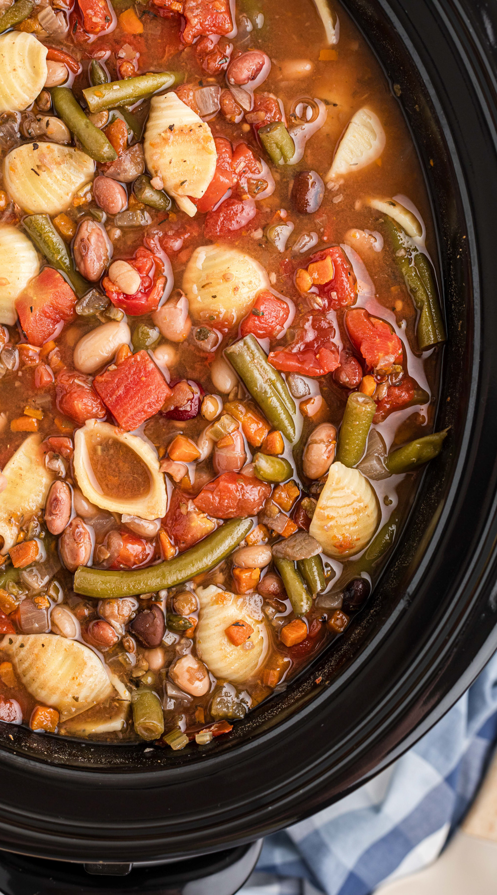 Long image of slow cooker 15 bean minestrone soup.
