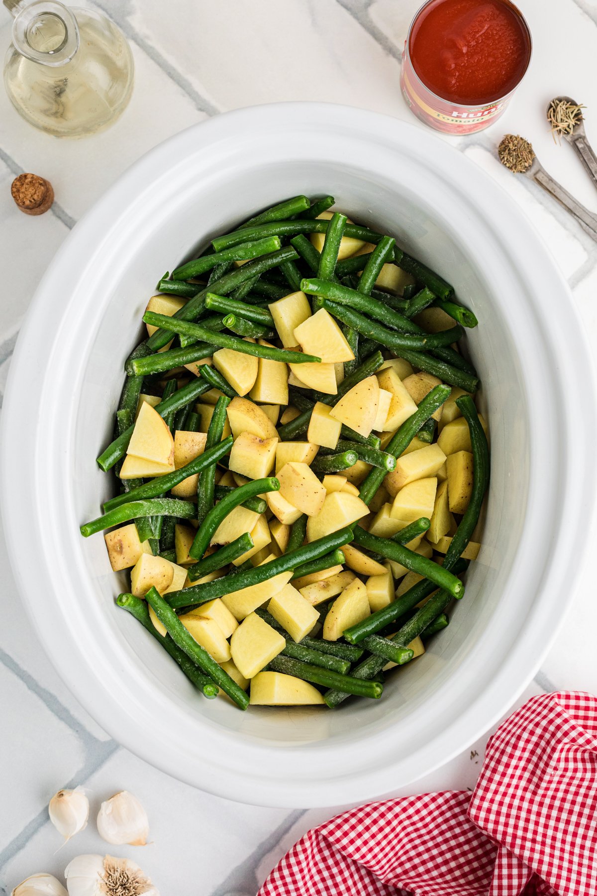 Green beans and potatoes in a crockpot.