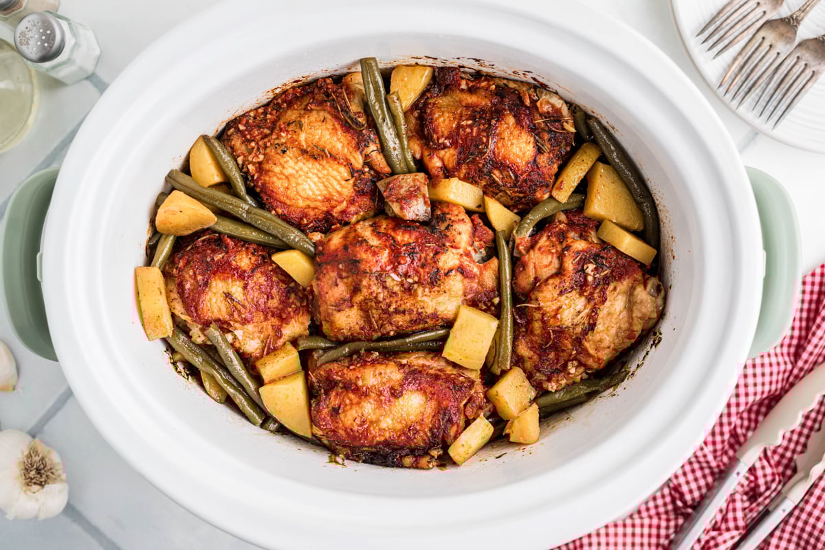 Overhead shot of slow cooker full chicken dinner.