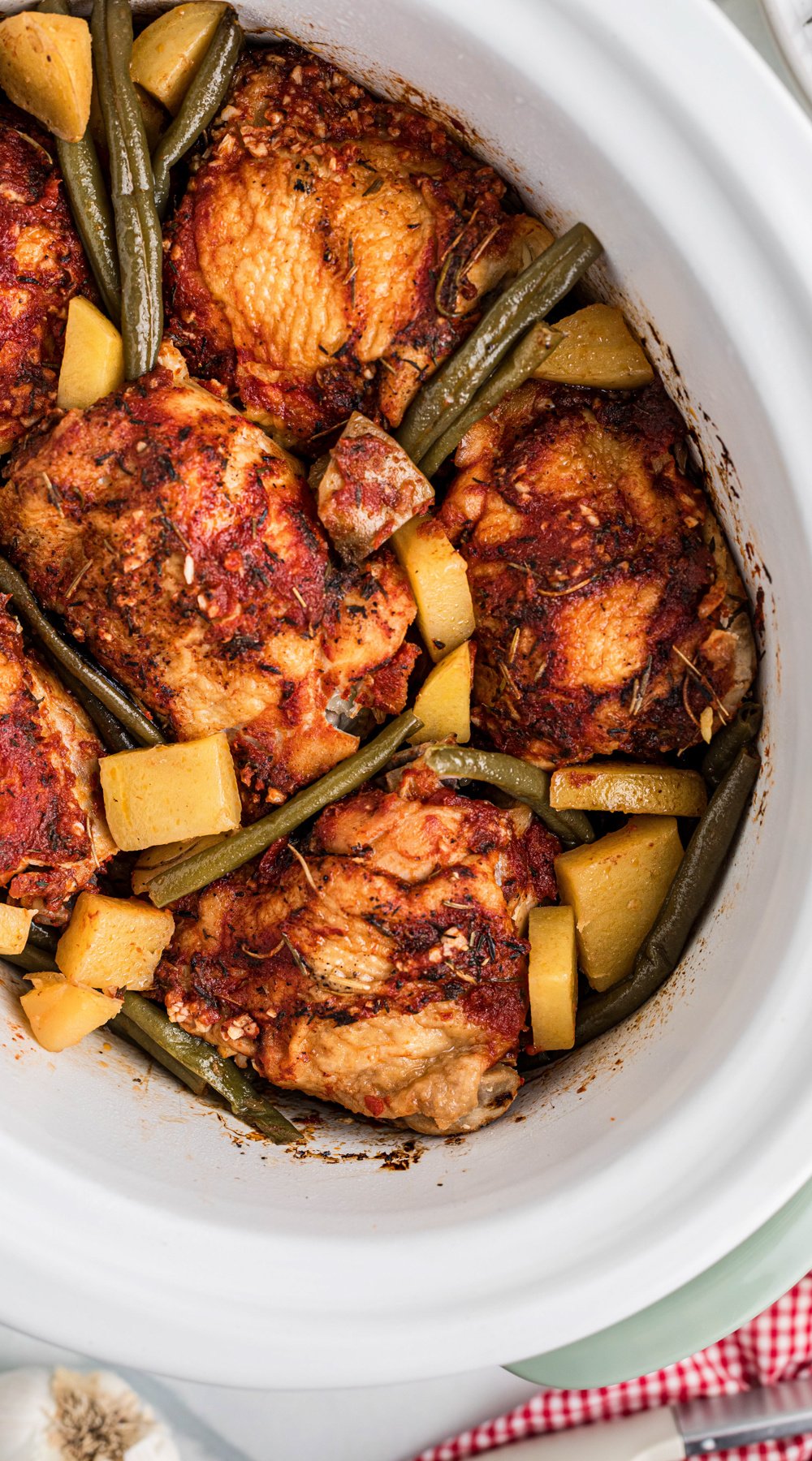 Long image of slow cooker full chicken dinner.