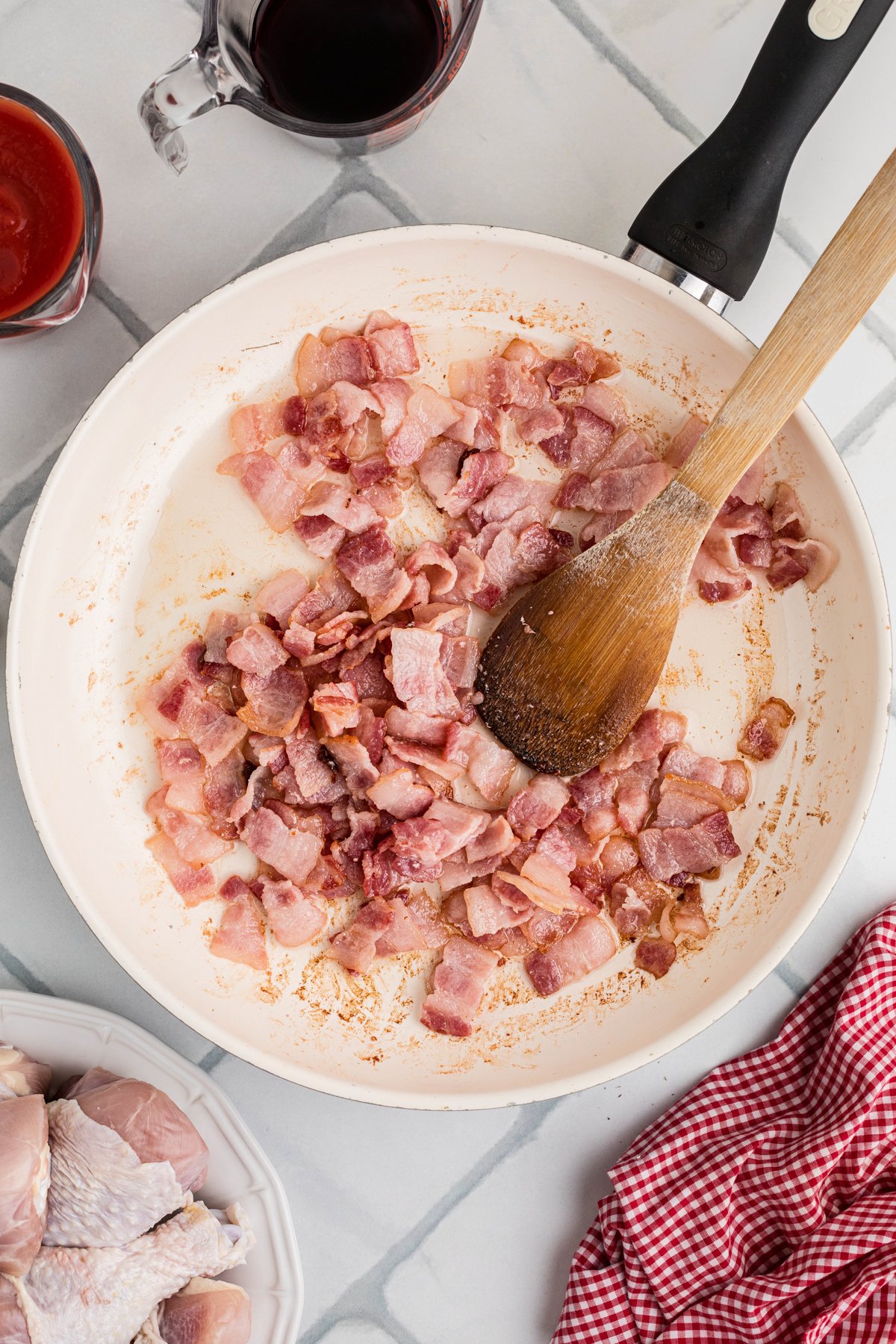 Cooking bacon in a skillet.