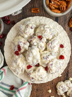 Overhead shot of slow cooker white chocolate cranberry clusters on a plate.