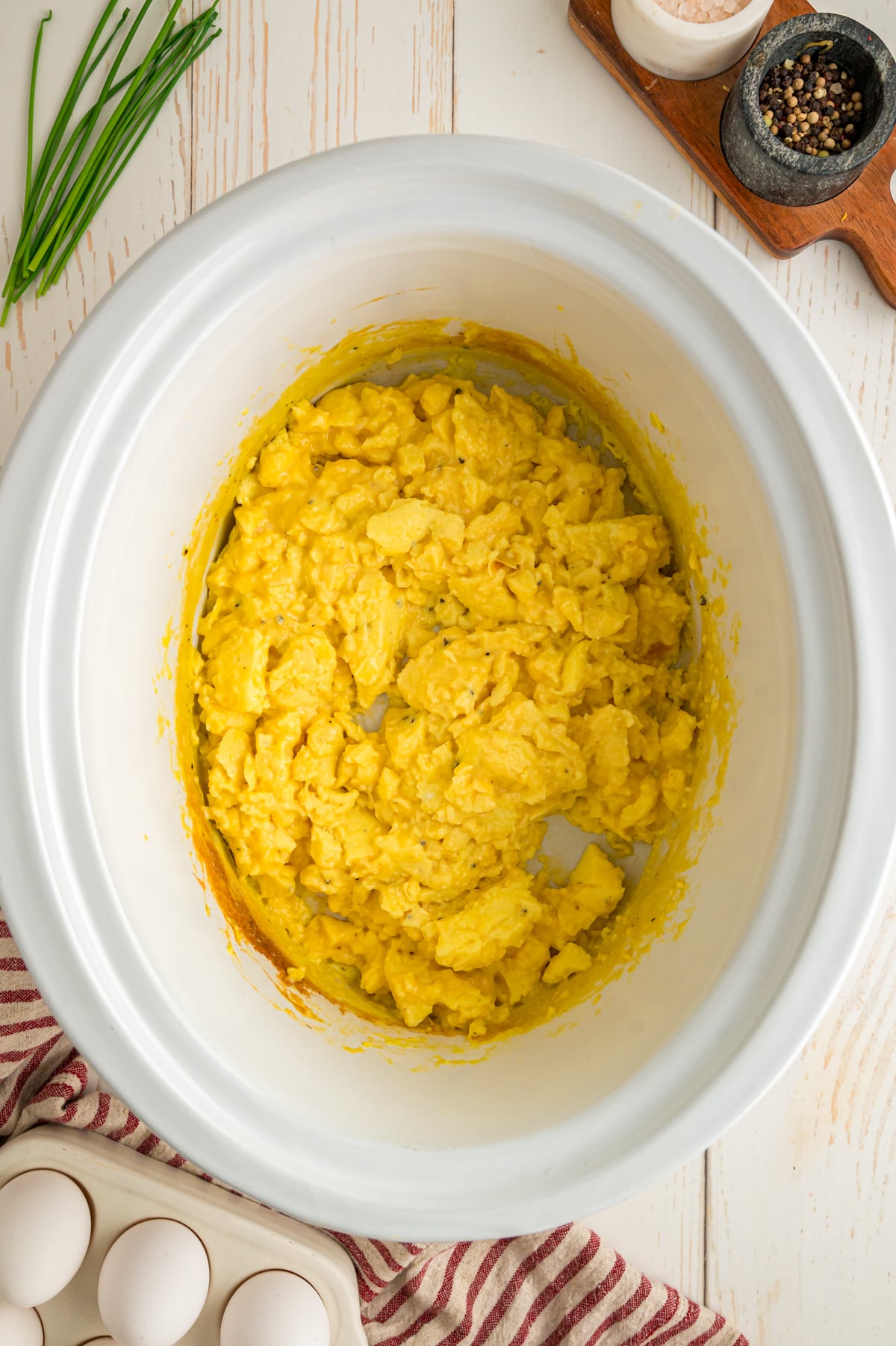 Scrambled eggs in a crockpot after cooking.