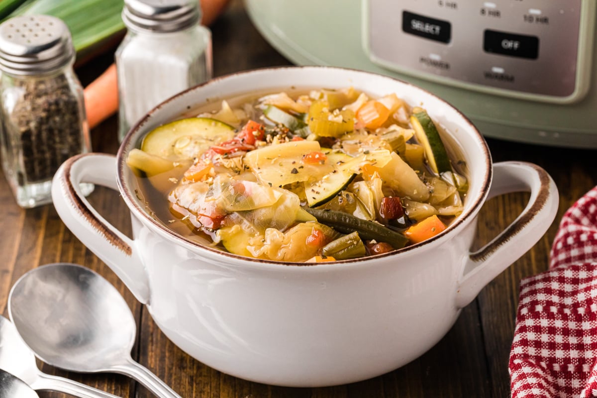 A serving of slow cooker weight loss soup in a white bowl.