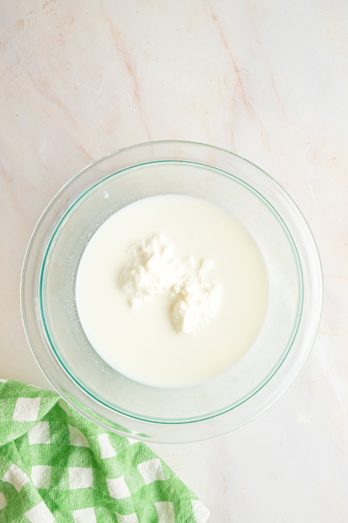 Milk and yogurt in a glass bowl.