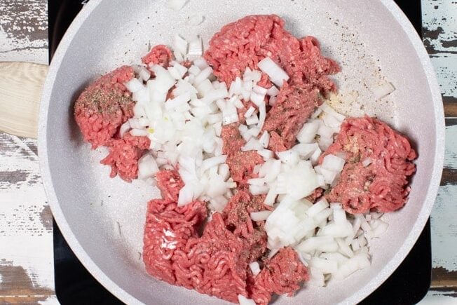 raw ground beef in a skillet