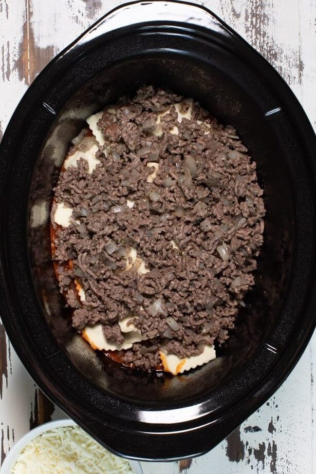 ground beef on top of ravioli.