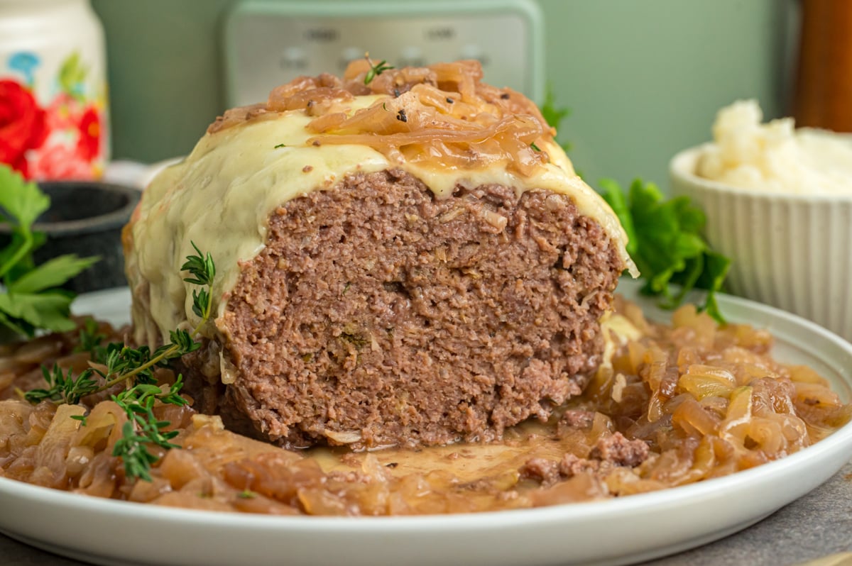 Open slow cooker french onion meatloaf on a serving plate.