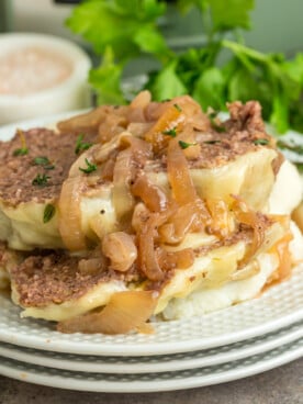 Sliced slow cooker french onion meatloaf on a plate.