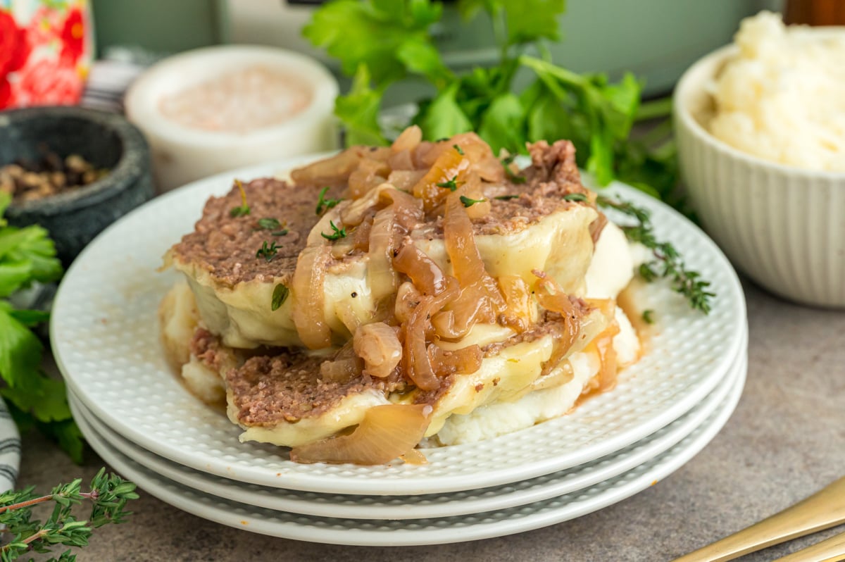 Sliced slow cooker french onion meatloaf on a plate.