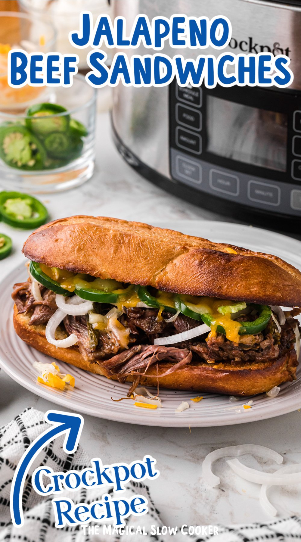 jalapeno beef sandwich in front of a slow cooker.