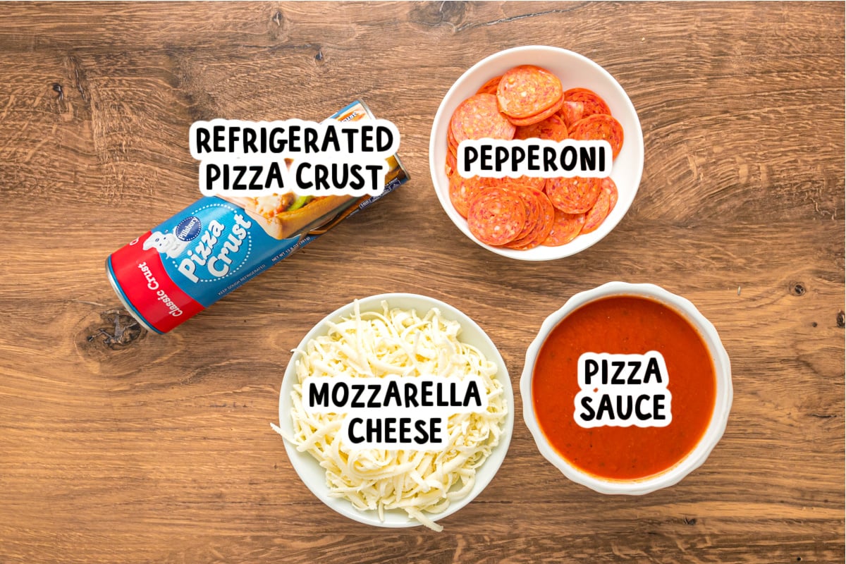 Ingredients for making slow cooker pizza on a table.