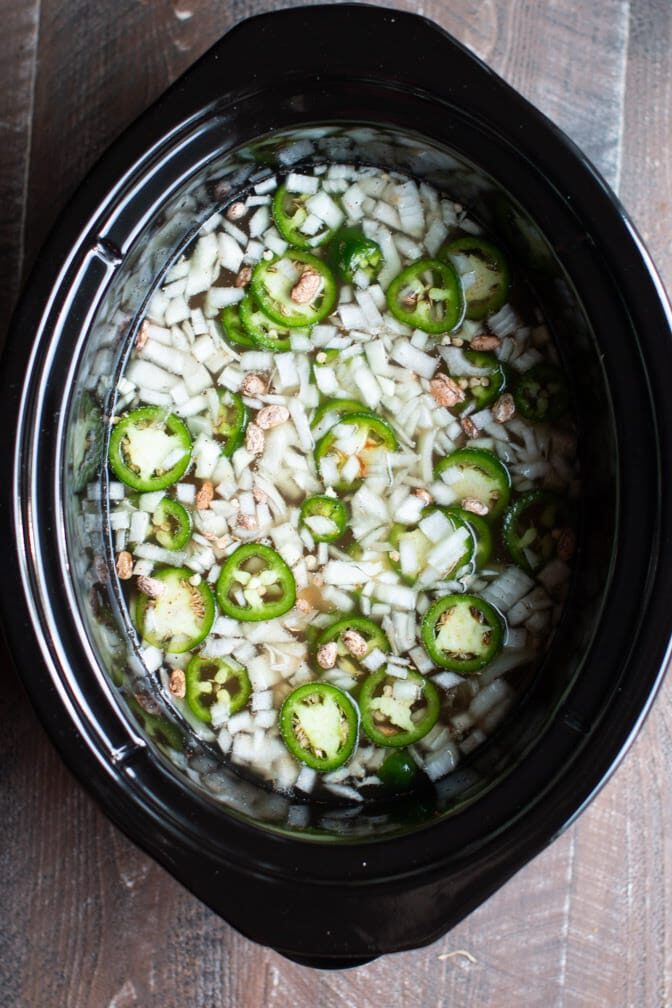 onions, pinto beans and jalapenos in slow cooker