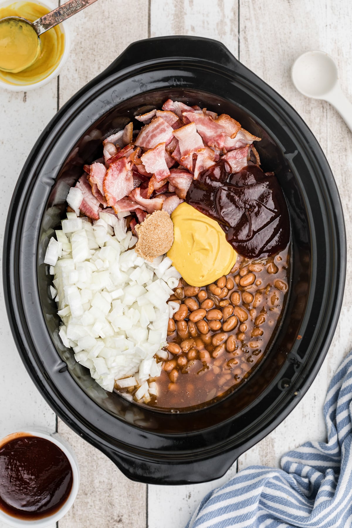 Ingredients for baked beans in a slow cooker.