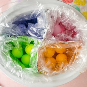 colored easter eggs divided in a slow cooker.