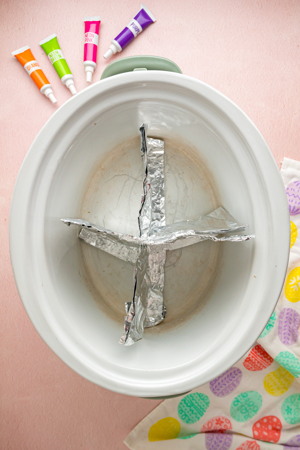 Aluminum foil in a slow cooker to create sections.