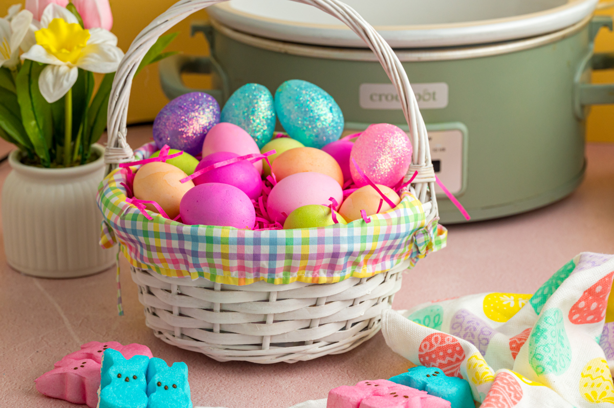 Slow cooker easter eggs in an easter basket.
