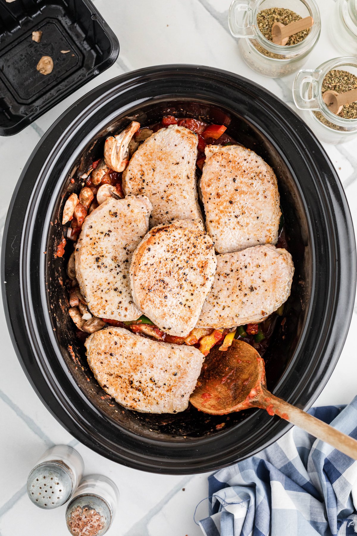 Seared pork chops in a crockpot.