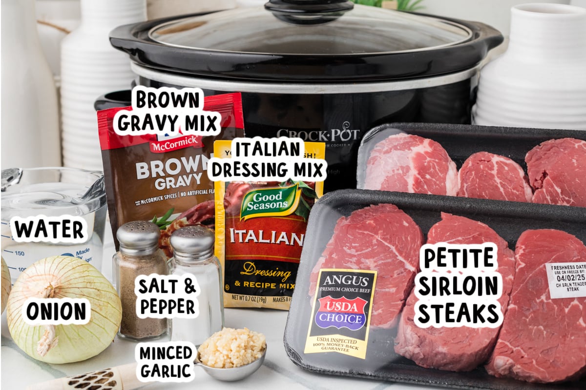 Ingredients for making steak and onions in front of a crockpot.