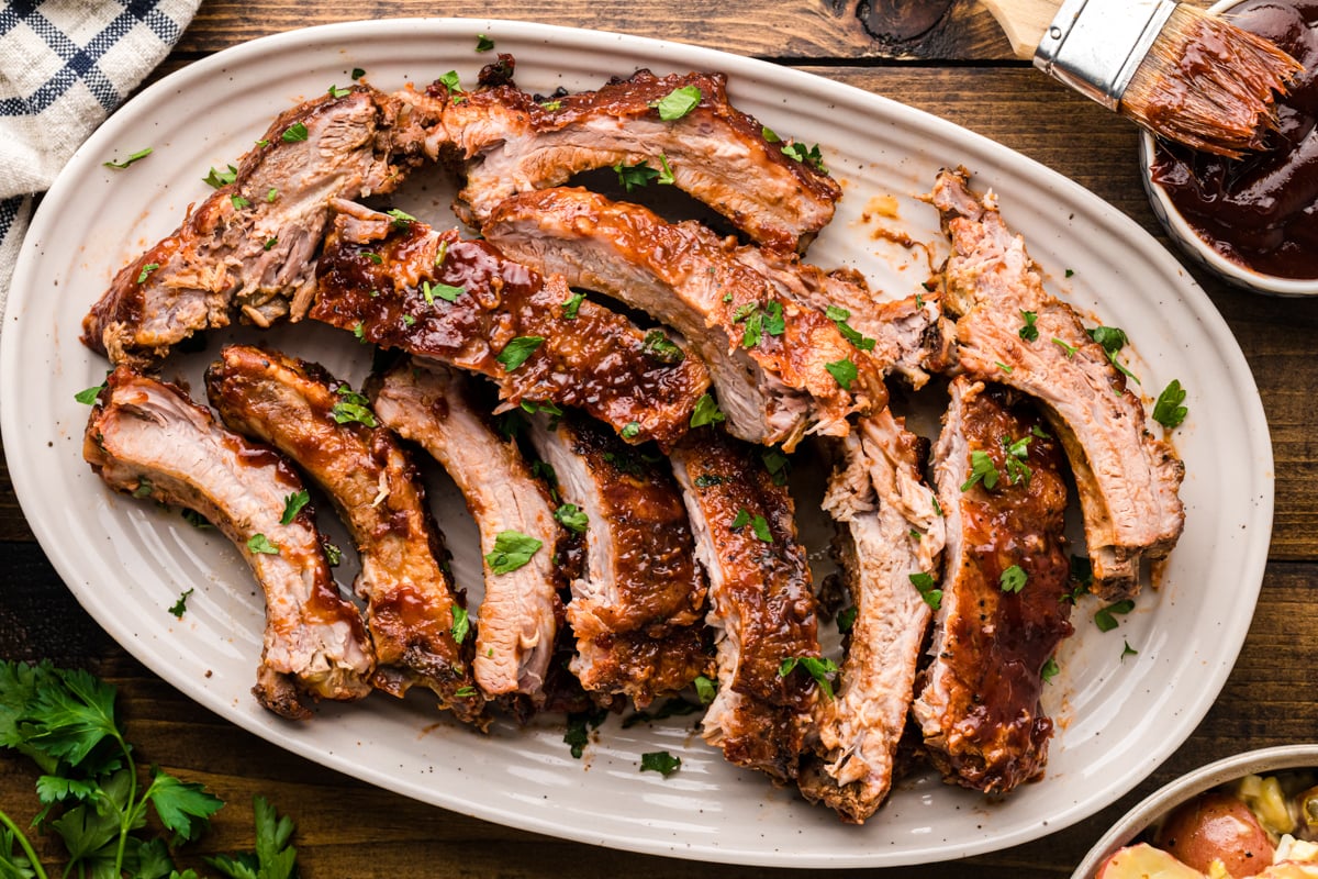 Slow cooker baby back ribs on a platter.