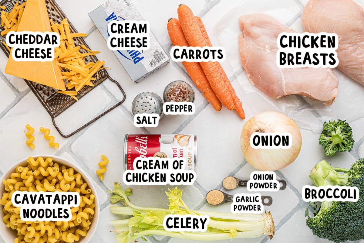 Ingredients for slow cooker chicken broccoli pasta on a table.