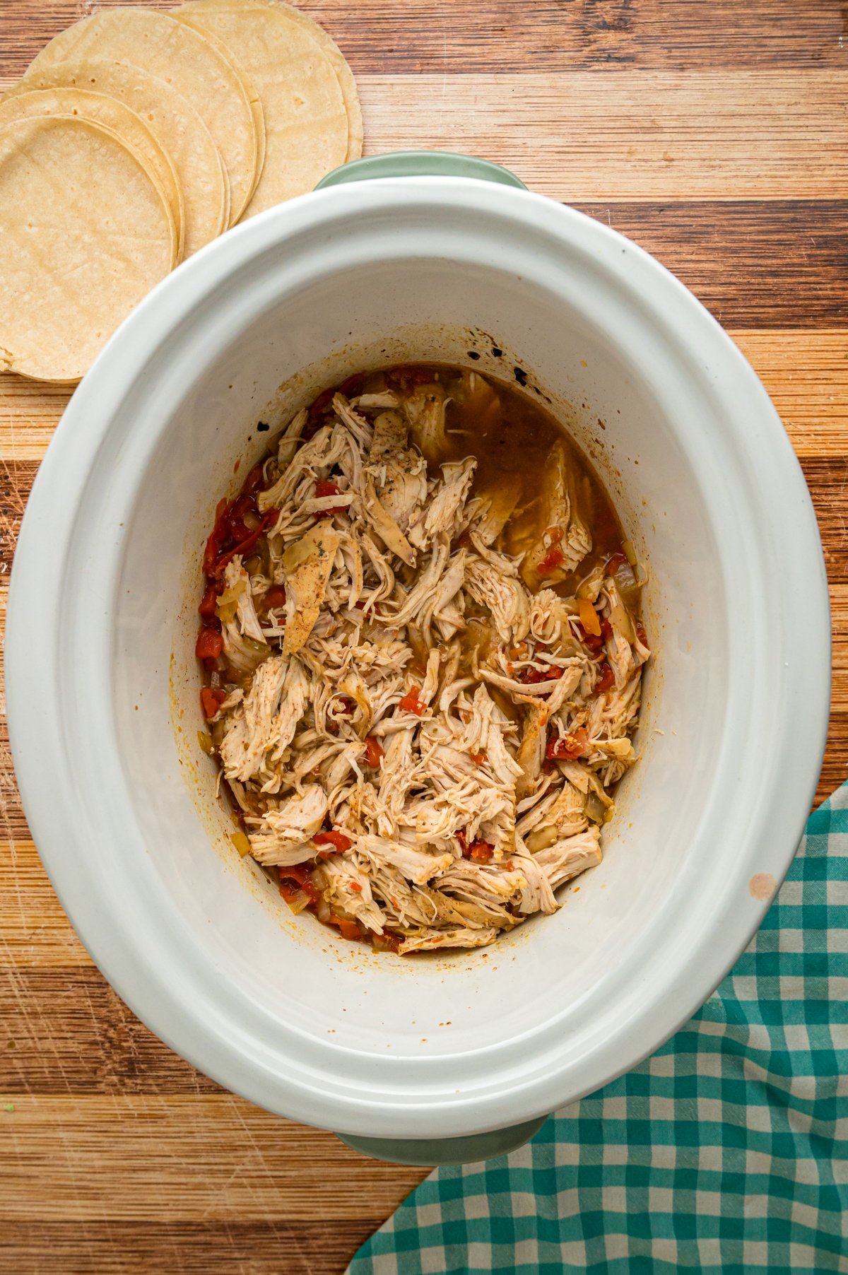 Shredded chicken in a crockpot.