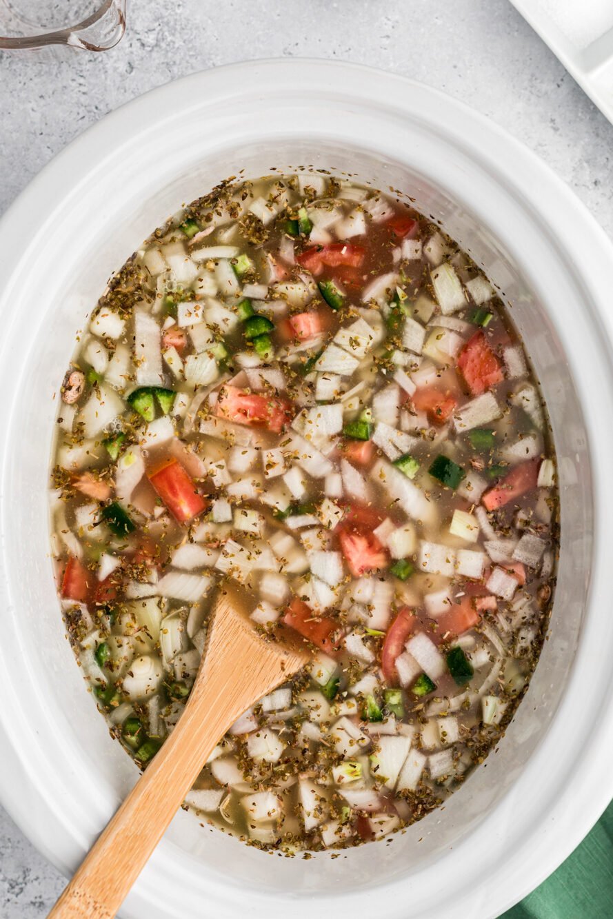 Chicken broth added to the pinto beans and vegeatables in the crockpot.