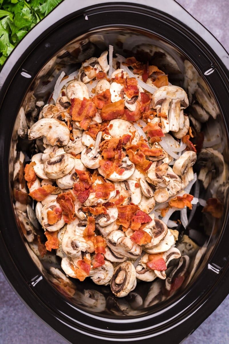 chicken, mushroom, bacon and onion in a slow cooker