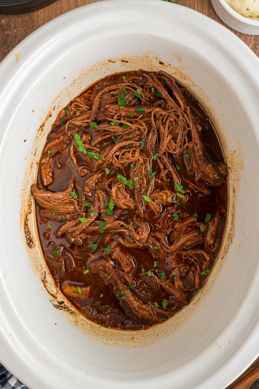 ready to serve flank steak in a slow cooker.
