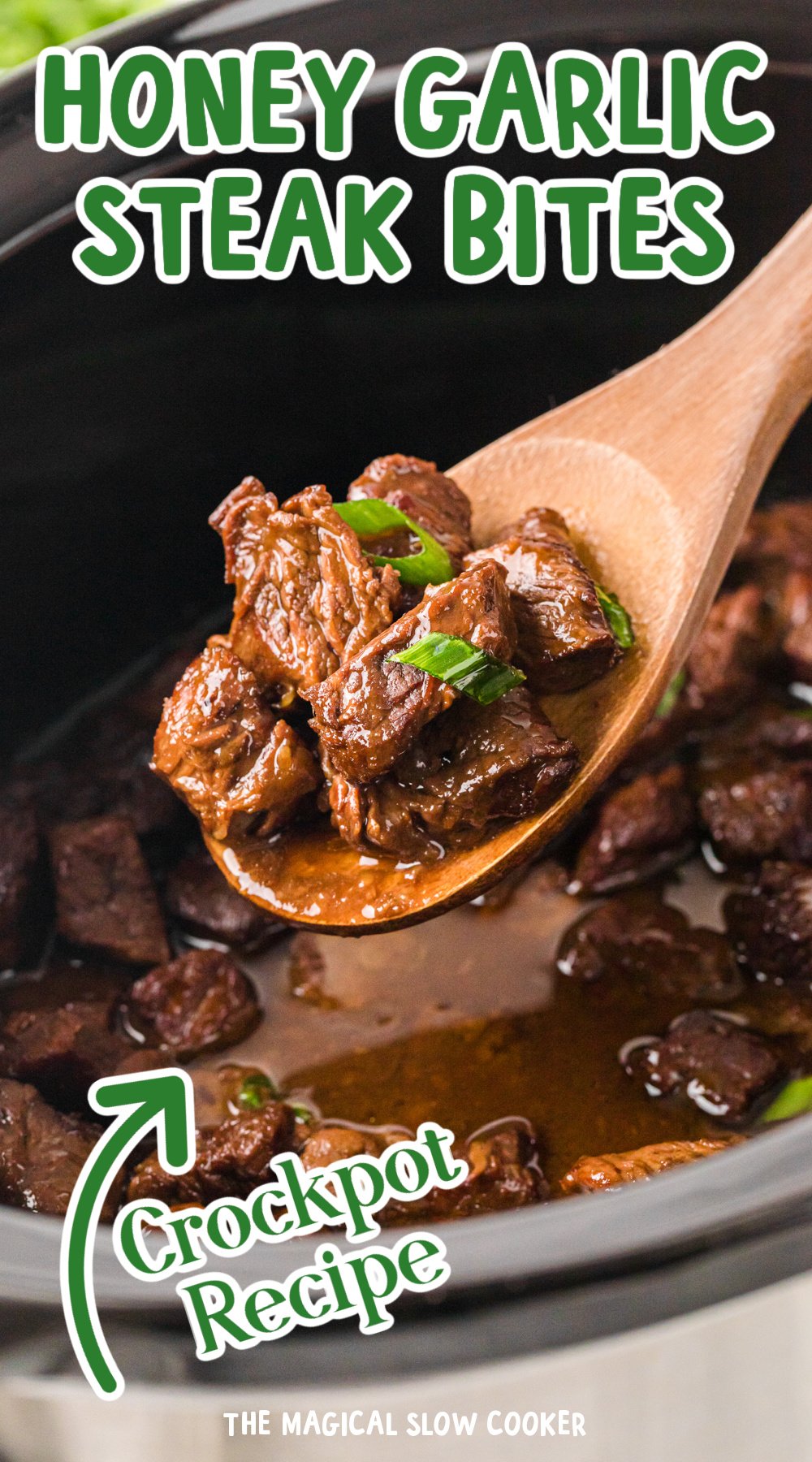 A big scoop of honey garlic steak bites on a wooden spoon with text overlay.