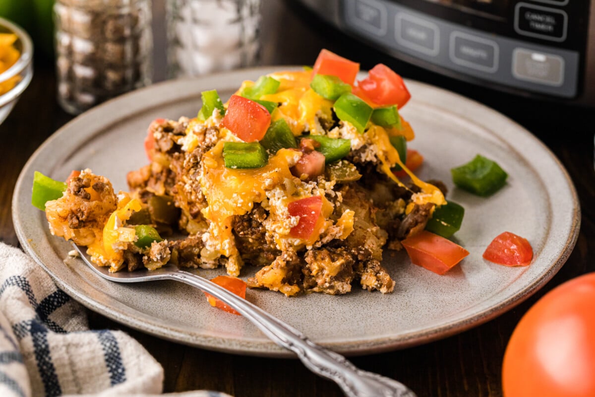 A serving of a beef and cheese casserole on a plate.