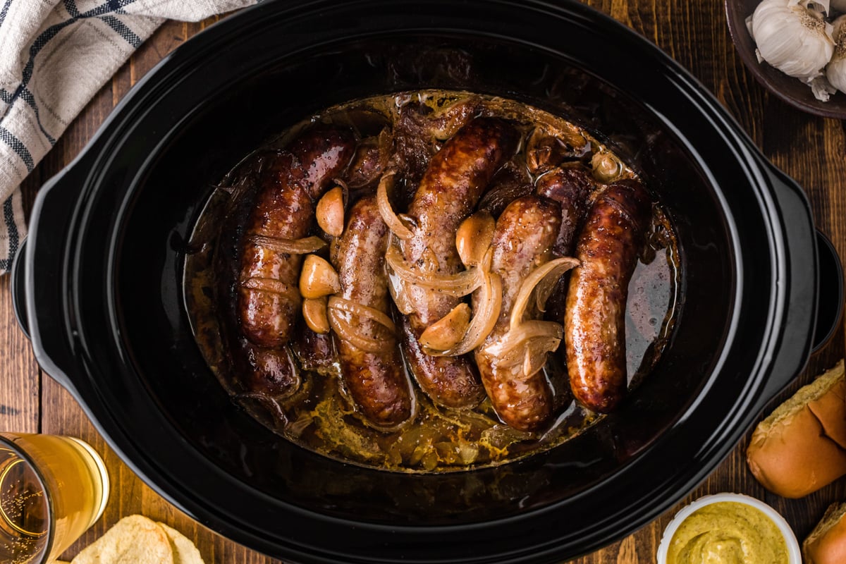 Bratwurst cooked with beer, onions, and garlic in a crockpot. 