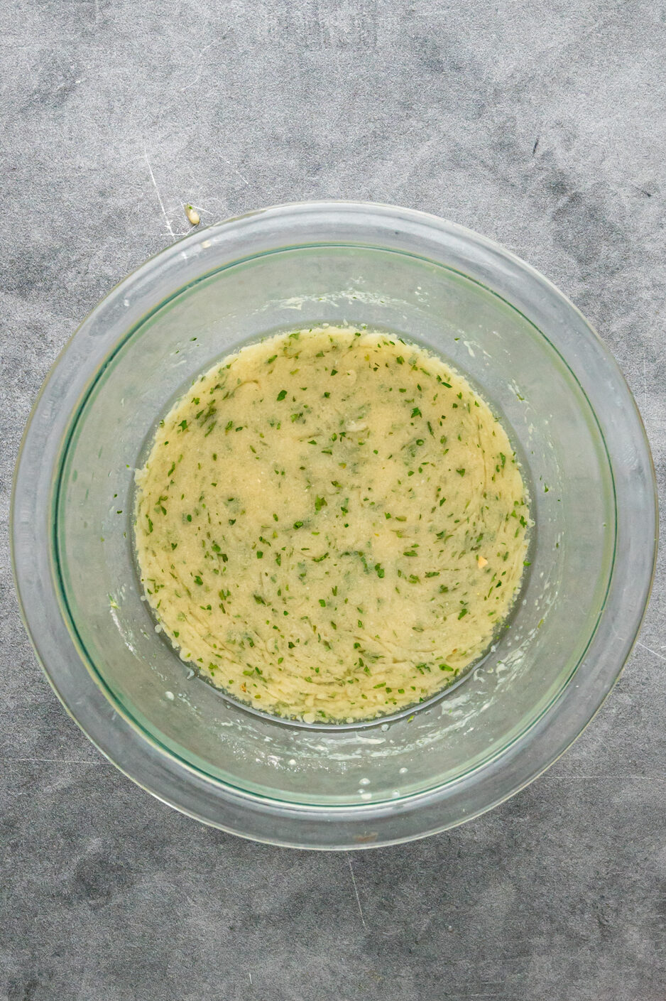 Ranch sauce mixture in a clear bowl.