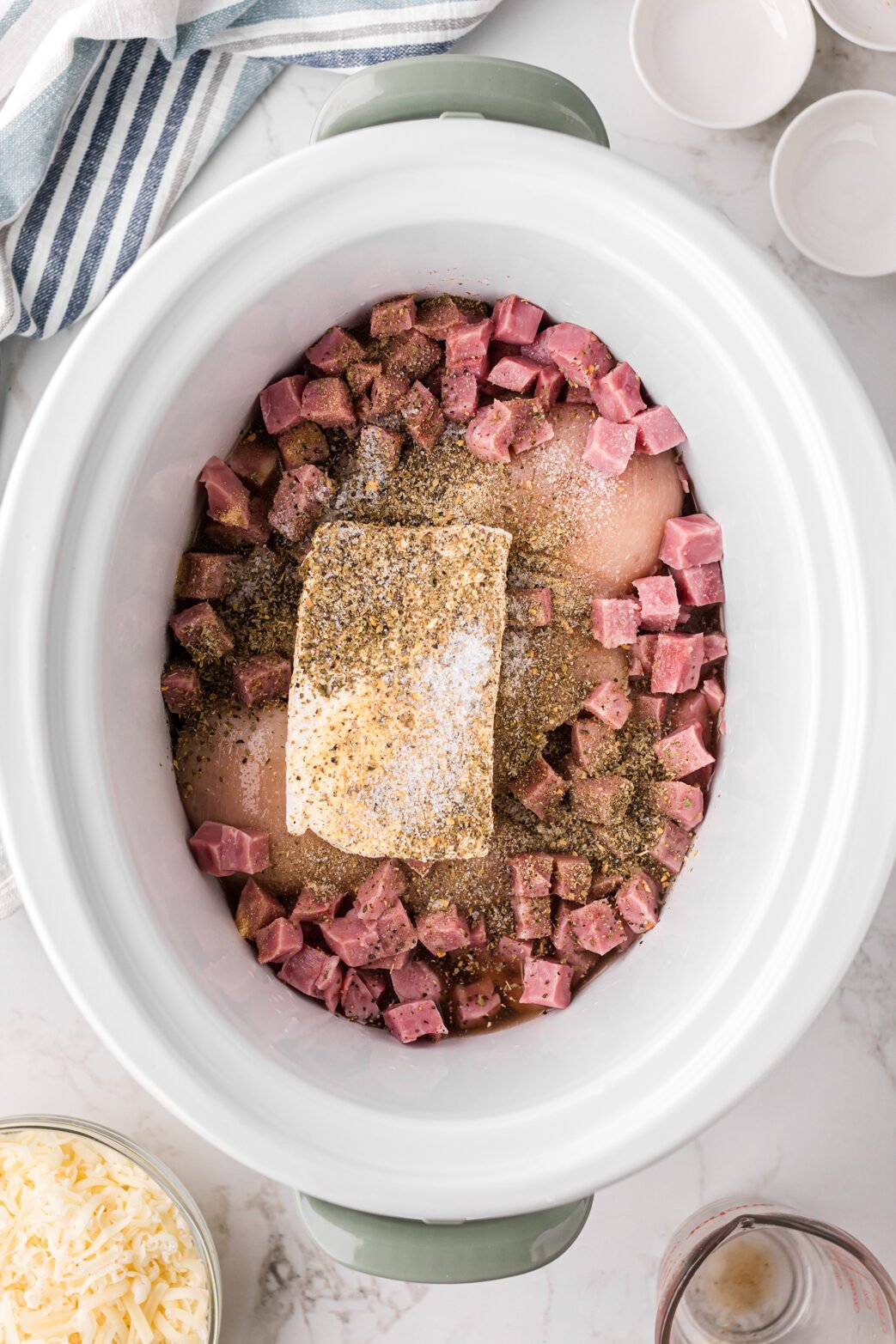 Ingredients for chicken cordon bleu pasta in a slow cooker.