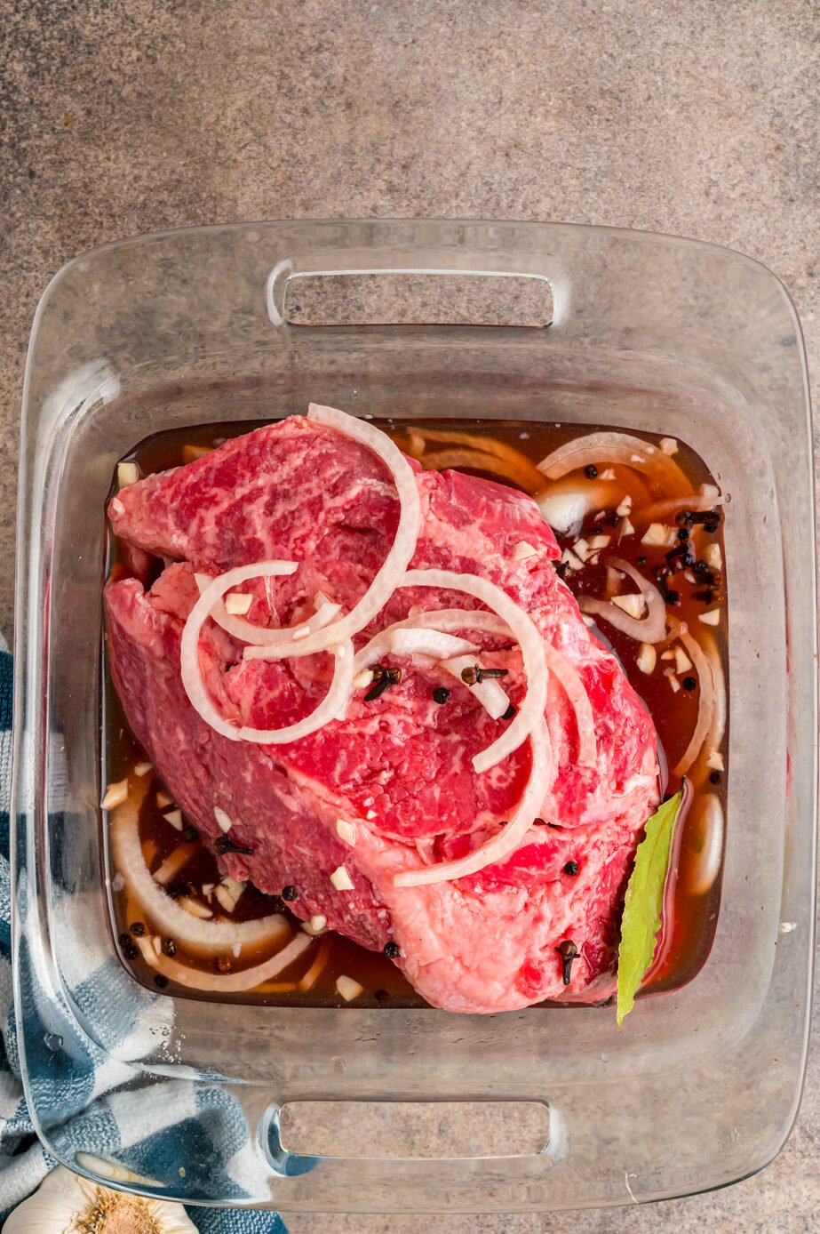 meat marinating with pickling spices, onion and vinegar.