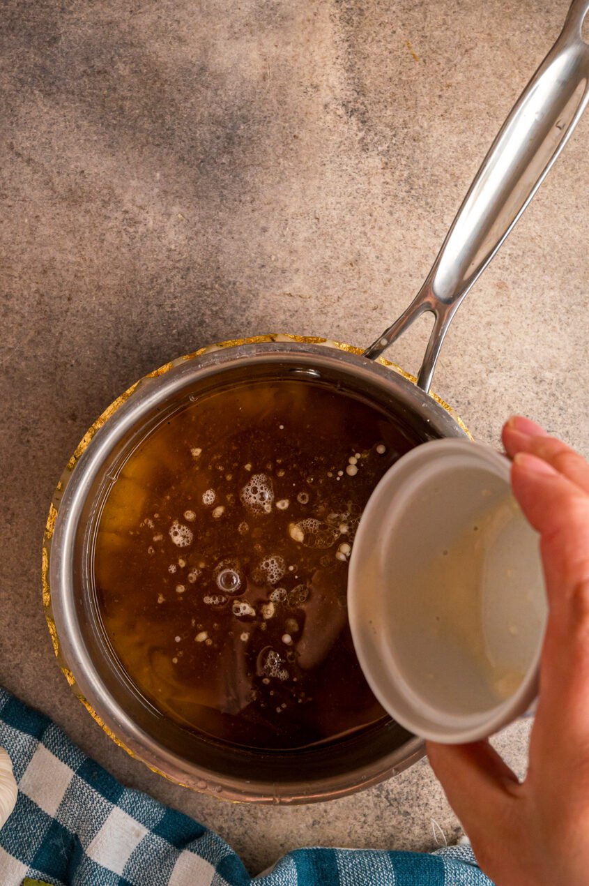 sauerbraten cooking liquid being thickened for gravy.