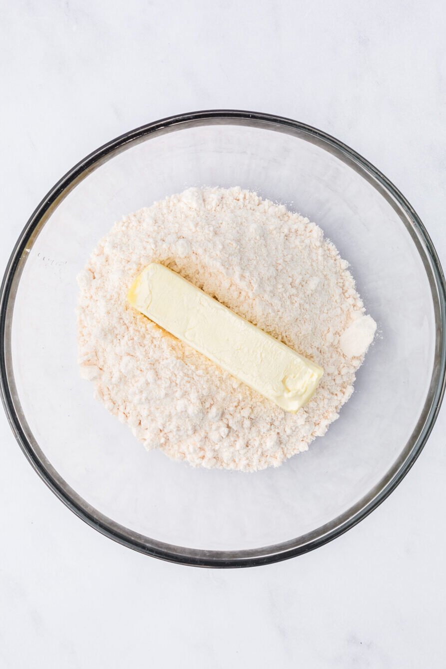 Butter and yellow cake mix in a bowl.