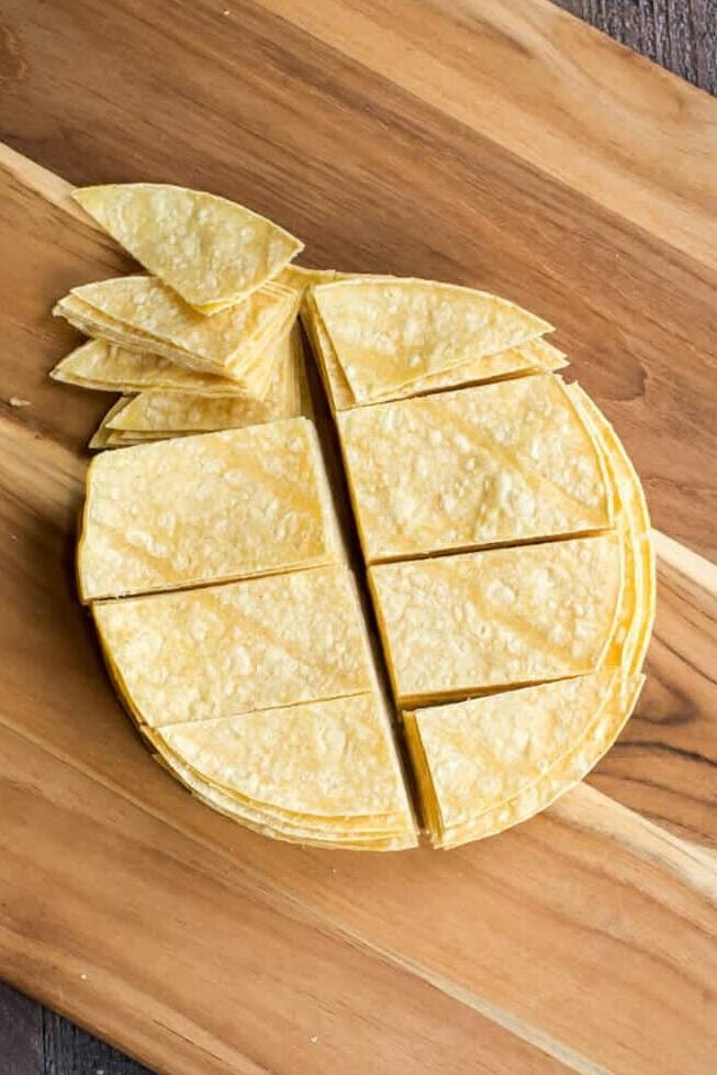 Corn toritllas cut into strips for chicken enchilada casserole.