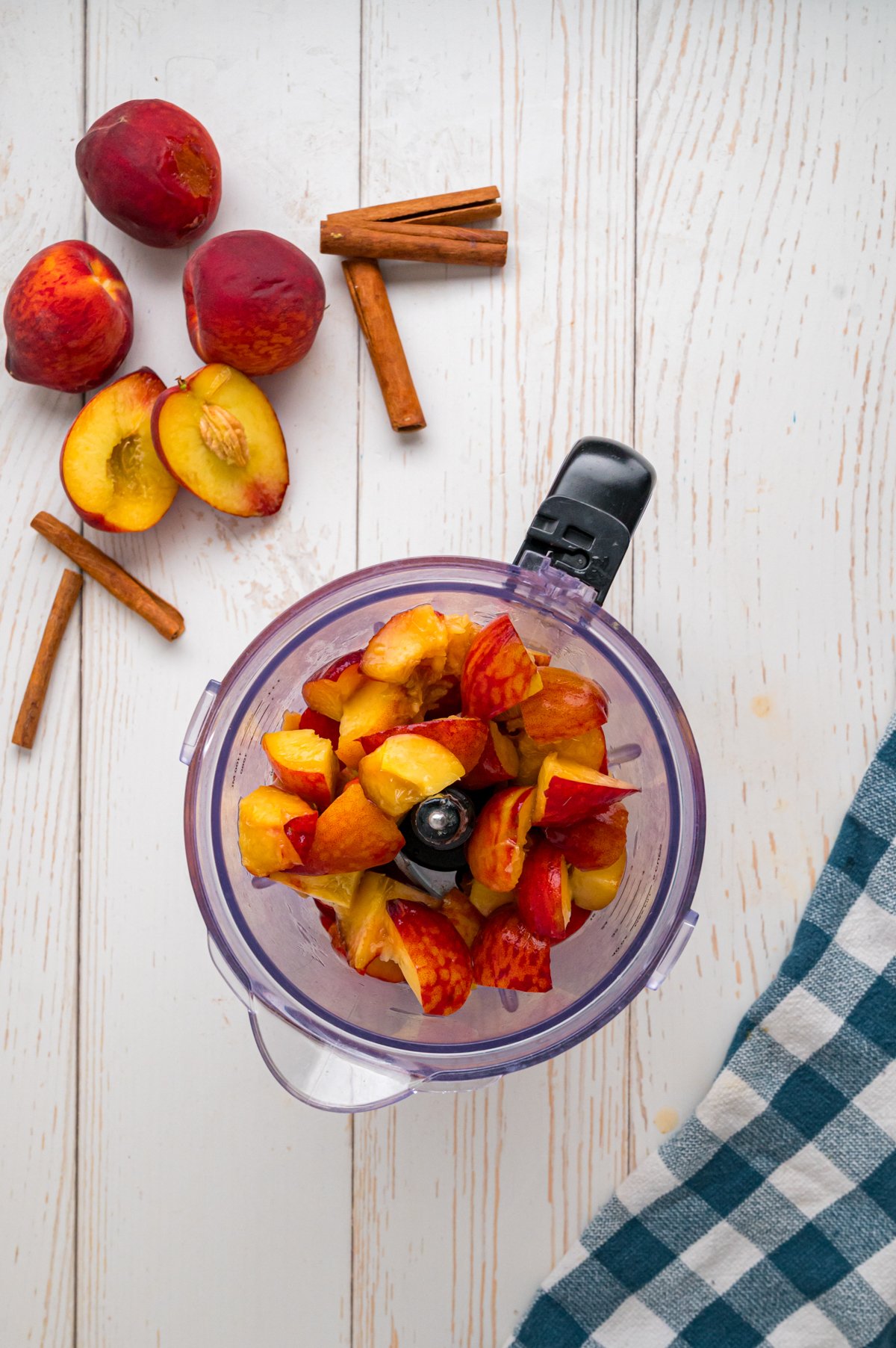 Peaches in a food processor before blending.