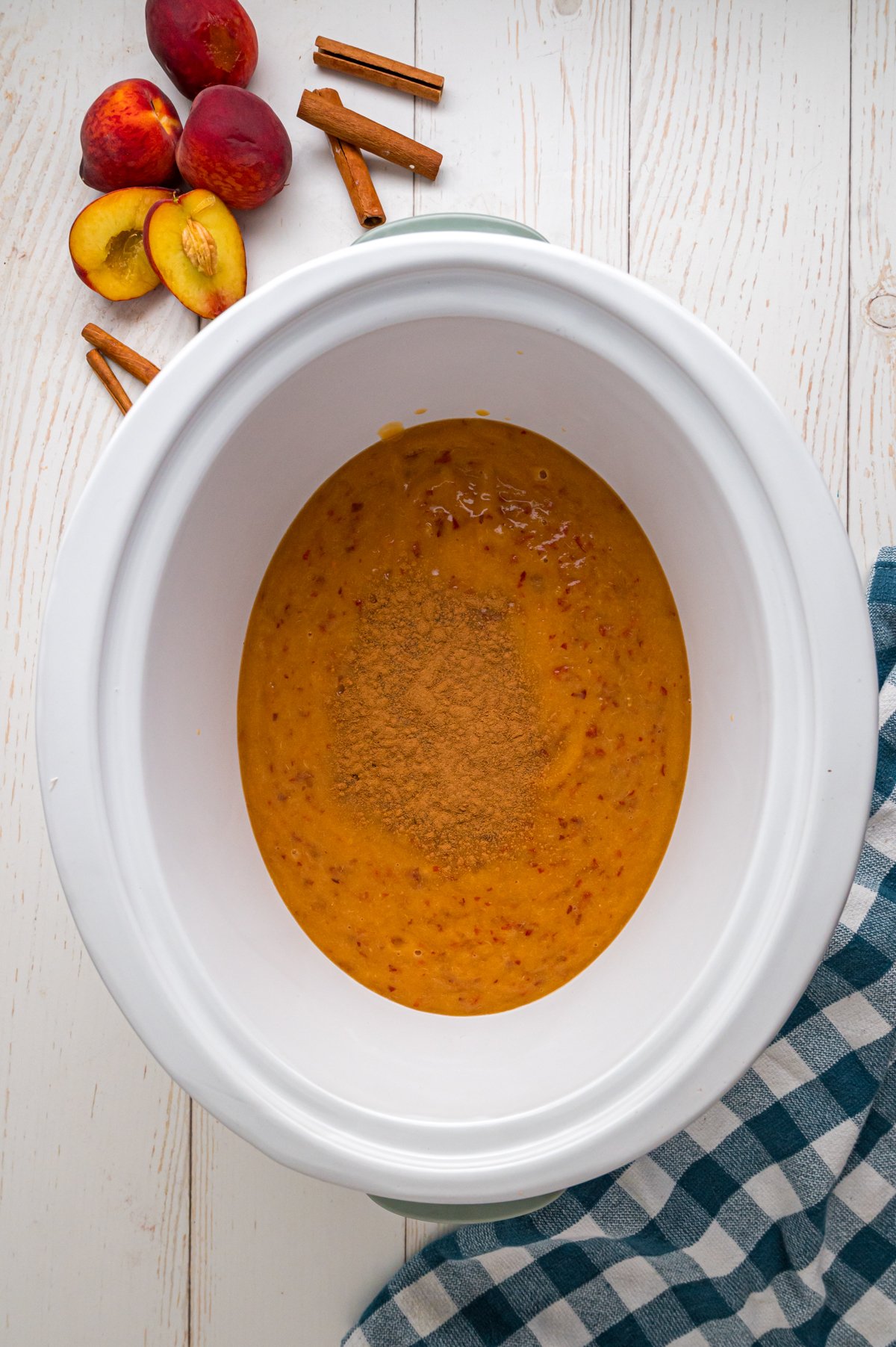 Blended peaches and cinnamon in a food processor.