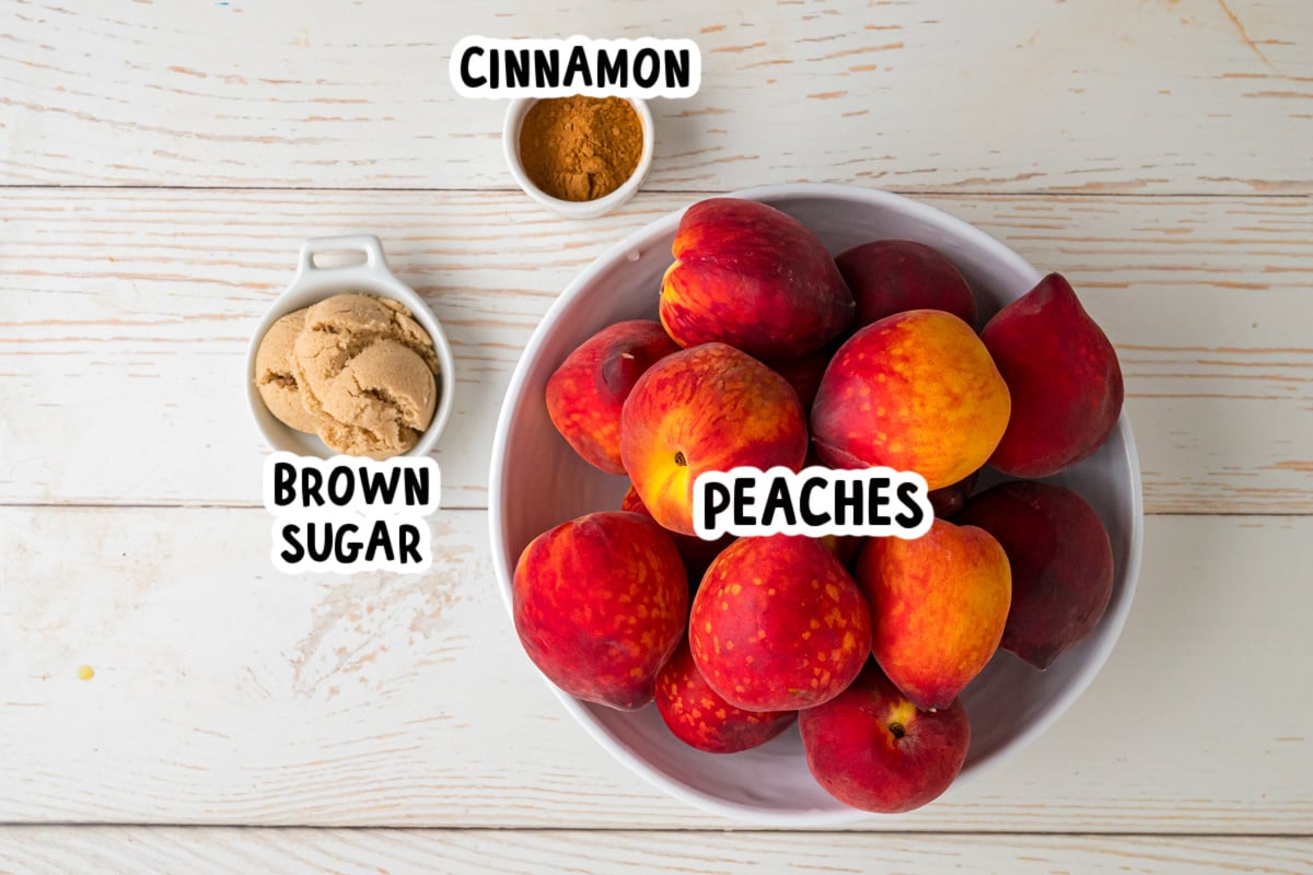 Ingredients for making peach butter on a table.
