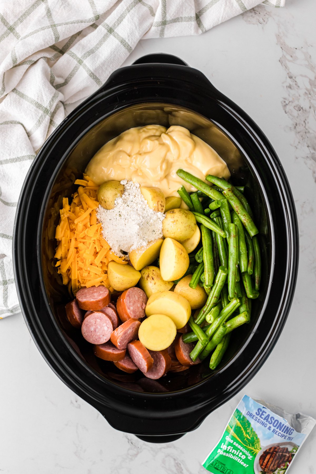 Ingredients for swamp potatoes in a crockpot.
