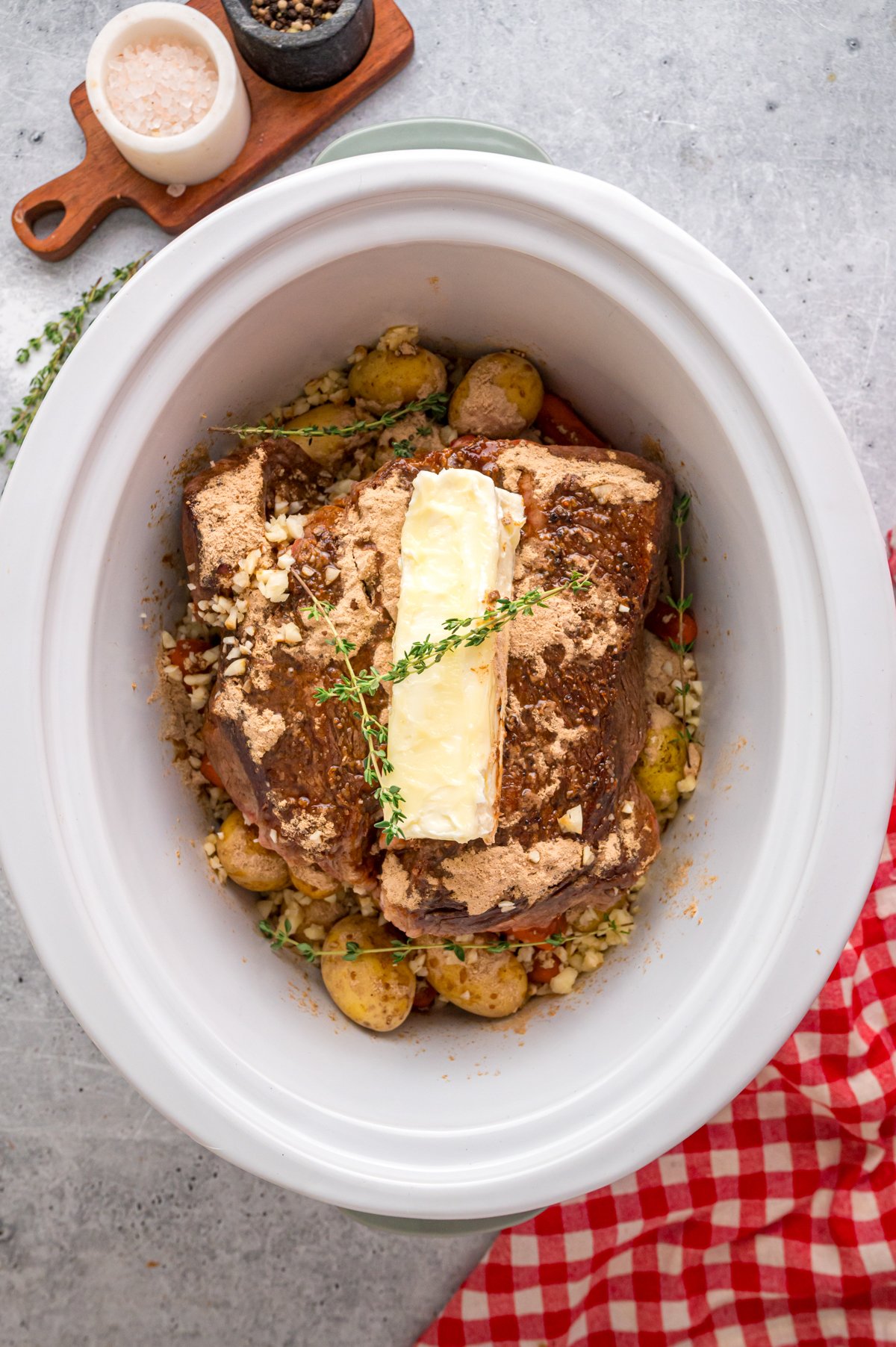 Ingredients for Worcestershire butter pot roast in a slow cooker.