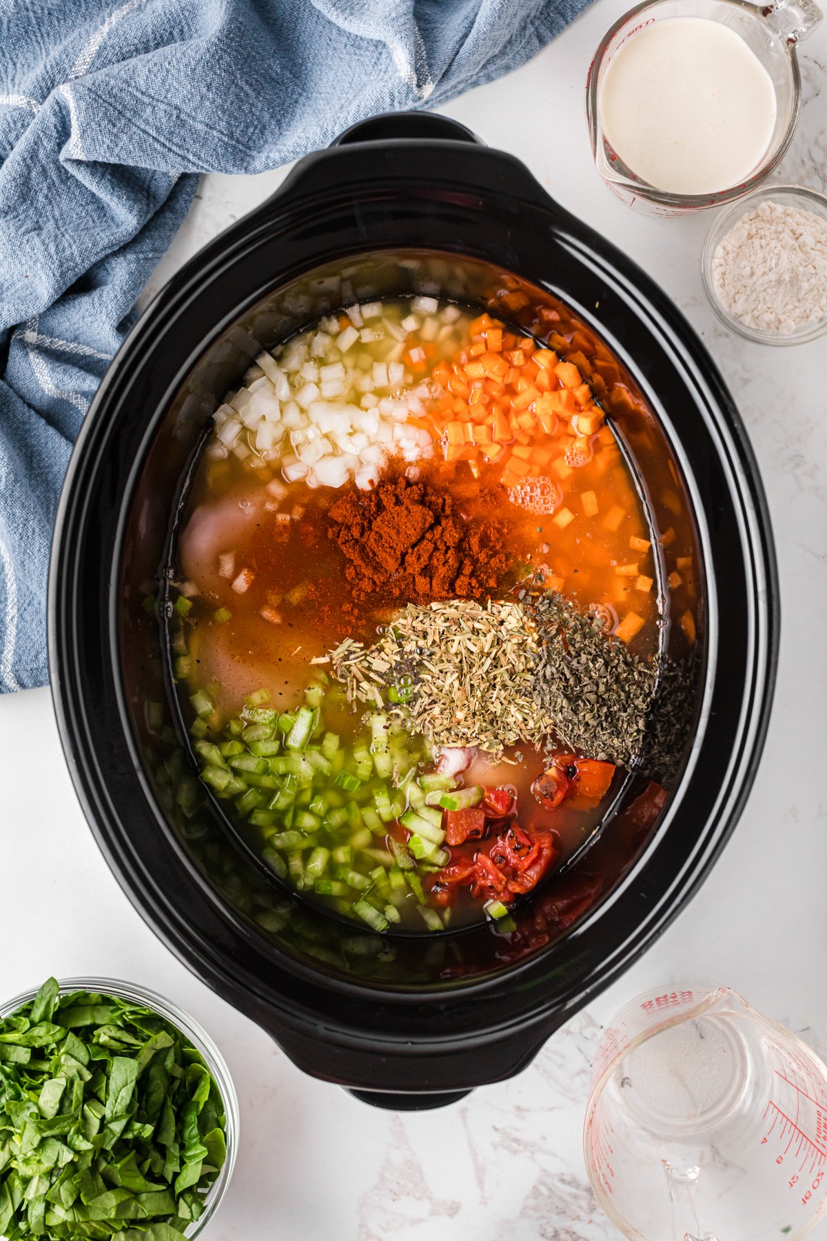 Ingredients for mama leone's chicken soup in a crockpot.