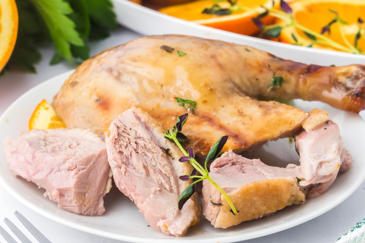 Sliced duck on a plate.