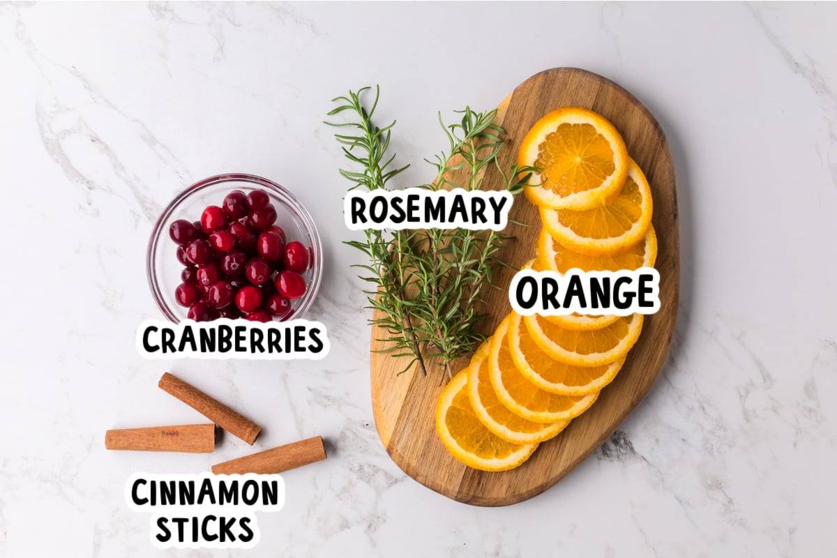 Ingredients for making Christmas potpourri on a table.