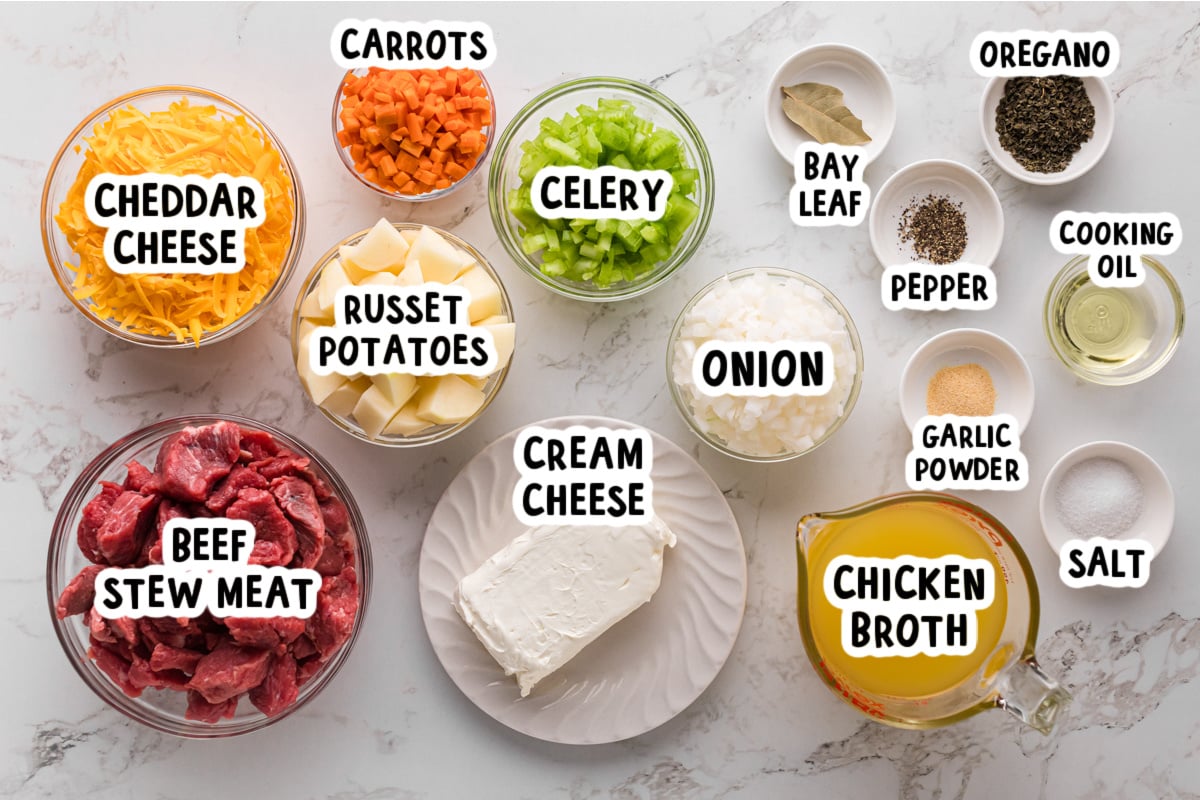 Ingredients for beef and cheddar soup on a table.