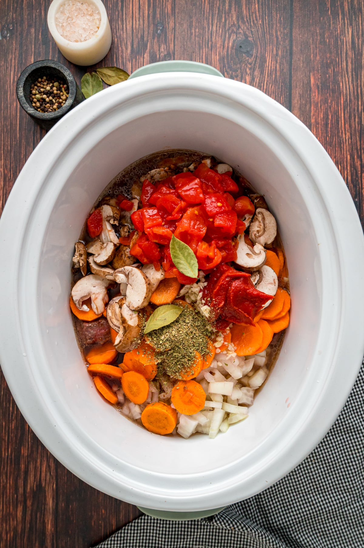 Ingredients for beef stew in a crockpot before cooking.