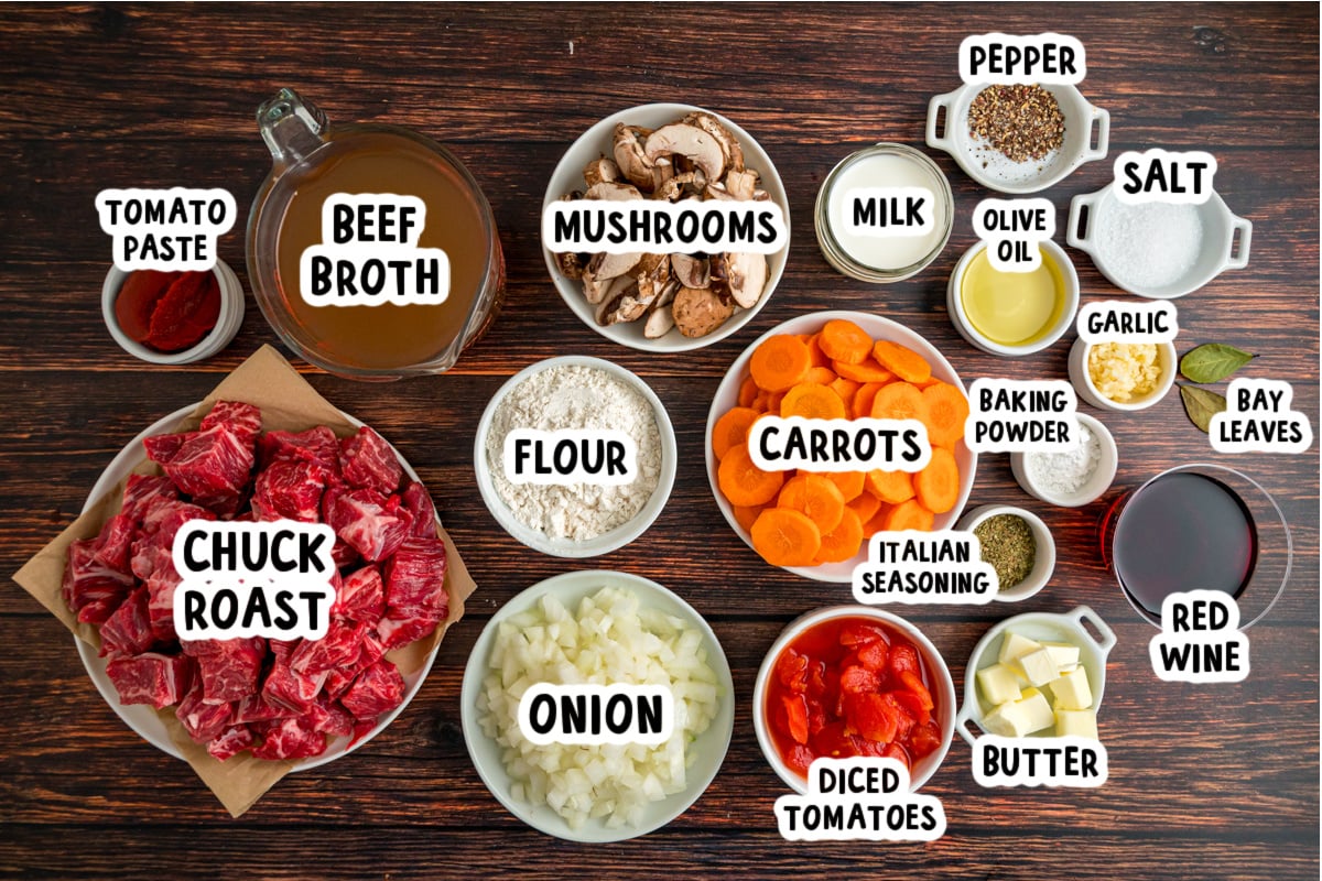 Ingredients for beef stew with dumplings on a table.