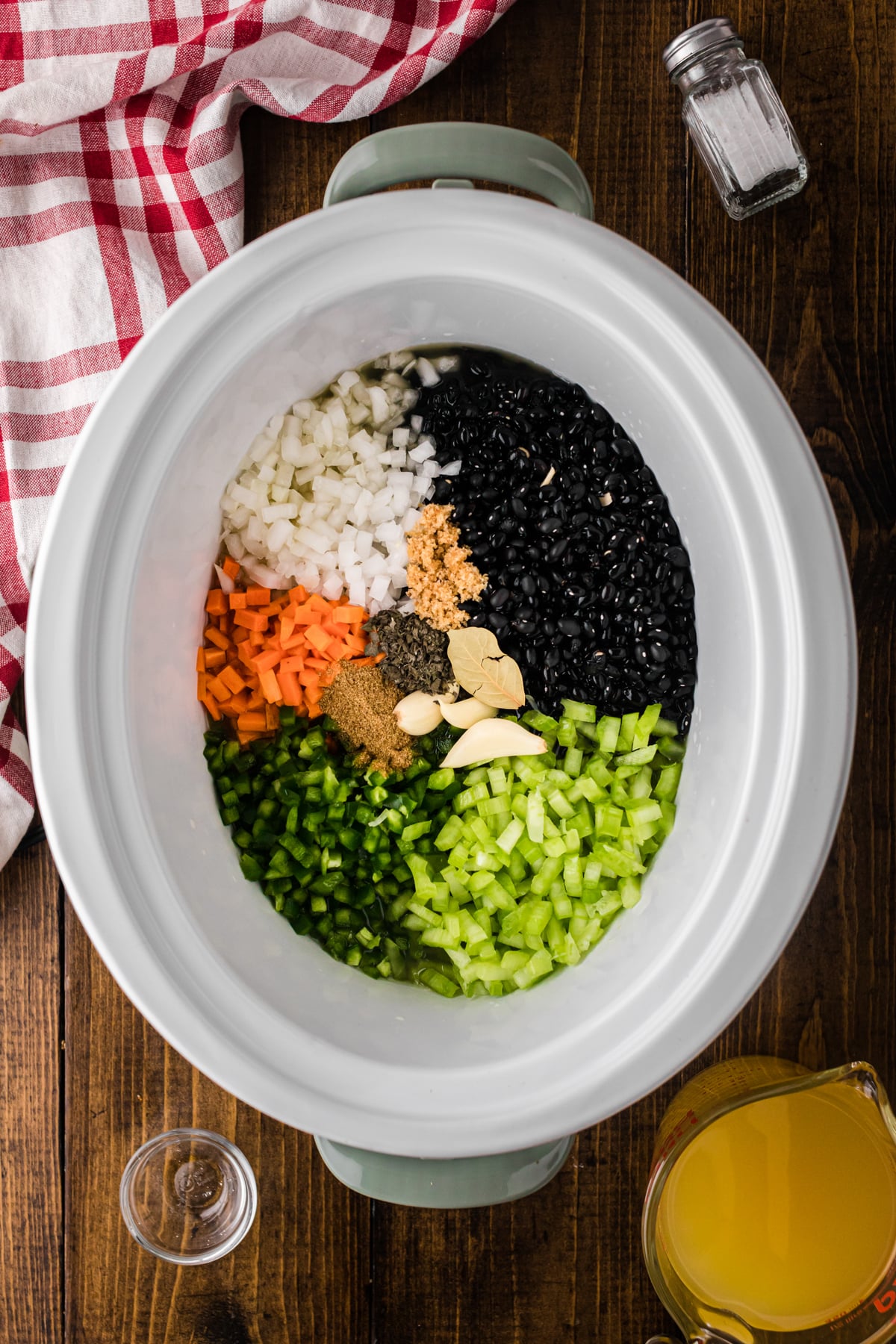 Ingredients for cuban black beans in a crockpot.